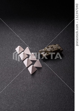Anti-tank barrier or dragon's teeth made of concrete and iron as a fortification. Dragon's teeth 132347040