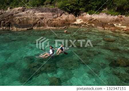 A couple kayaks near a tropical beach on Redang Island in Malaysia A couple kayaks near a tropical beach on Redang Island in Malaysia 132347151