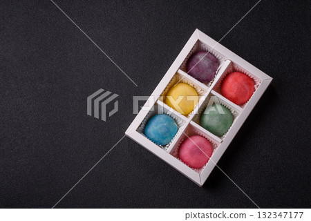 Japanese mochi, ice cream or Asian sweets with fruit filling. Mochi of different colors 132347177