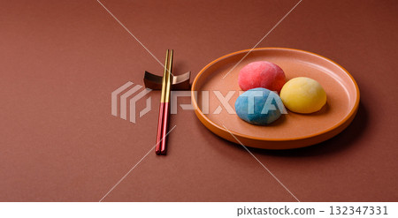 Japanese mochi, ice cream or Asian sweets with fruit filling. Mochi of different colors 132347331