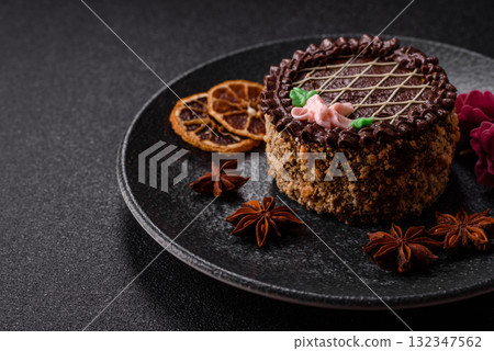Sweet tart, pie with chocolate and cream with fruit filling on a plate. Chocolate tart 132347562