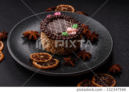 Sweet tart, pie with chocolate and cream with fruit filling on a plate. Chocolate tart Sweet tart, pie with chocolate and cream with fruit filling on a plate. Chocolate tart 132347566