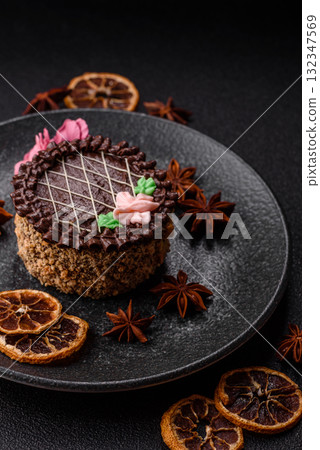 Sweet tart, pie with chocolate and cream with fruit filling on a plate. Chocolate tart Sweet tart, pie with chocolate and cream with fruit filling on a plate. Chocolate tart 132347569