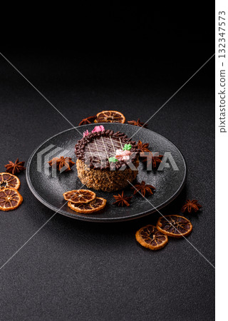 Sweet tart, pie with chocolate and cream with fruit filling on a plate. Chocolate tart Sweet tart, pie with chocolate and cream with fruit filling on a plate. Chocolate tart 132347573
