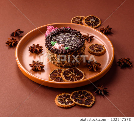 Sweet tart, pie with chocolate and cream with fruit filling on a plate. Chocolate tart 132347578
