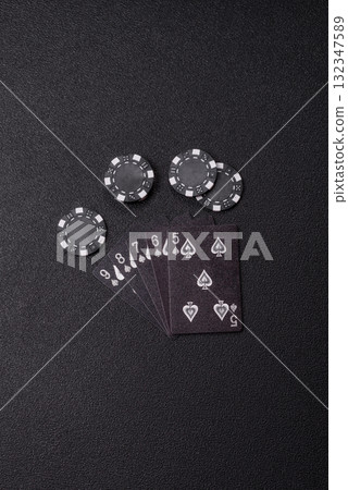 Playing card game poker in casino with chips, bets and risk. Cards and chips 132347589