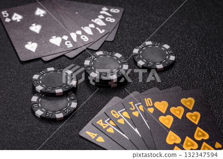 Playing card game poker in casino with chips, bets and risk. Cards and chips 132347594