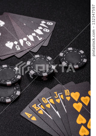Playing card game poker in casino with chips, bets and risk. Cards and chips Playing card game poker in casino with chips, bets and risk. Cards and chips 132347597