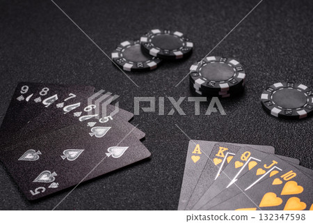 Playing card game poker in casino with chips, bets and risk. Cards and chips Playing card game poker in casino with chips, bets and risk. Cards and chips 132347598
