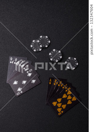 Playing card game poker in casino with chips, bets and risk. Cards and chips Playing card game poker in casino with chips, bets and risk. Cards and chips 132347604