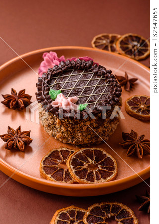 Sweet tart, pie with chocolate and cream with fruit filling on a plate. Chocolate tart Sweet tart, pie with chocolate and cream with fruit filling on a plate. Chocolate tart 132347655