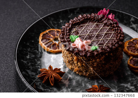 Sweet tart, pie with chocolate and cream with fruit filling on a plate. Chocolate tart 132347668