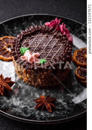 Sweet tart, pie with chocolate and cream with fruit filling on a plate. Chocolate tart 132347671
