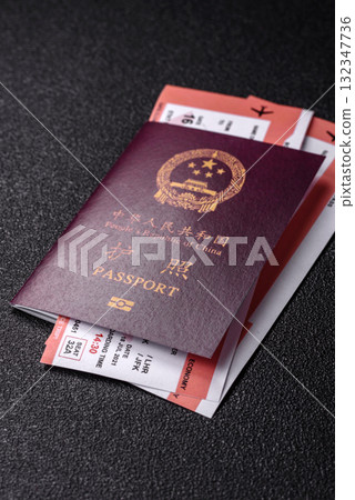China, Chinese passport with money and flight tickets. Chinese passport with tickets China, Chinese passport with money and flight tickets. Chinese passport with tickets 132347736