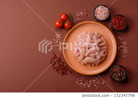Raw chicken meat cut into strips, fresh fillet or breast slices. Chicken raw meat in pieces Raw chicken meat cut into strips, fresh fillet or breast slices. Chicken raw meat in pieces 132347799