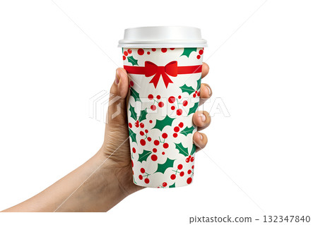 Hand holding festive christmas coffee cup with holly berry and leaf design, seasonal beverage isolated on transparent background 132347840