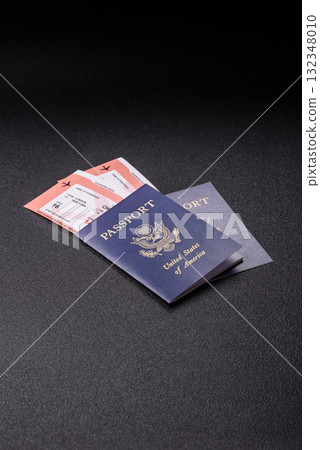 US passport or id document with tickets for flight, travel, border crossing. US passport and tickets US passport or id document with tickets for flight, travel, border crossing. US passport and tickets 132348010
