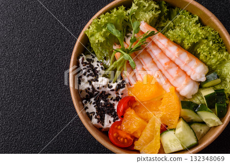 Bowl with shrimps, seafood, rice, oranges, tomatoes with sauce. Bowl with prawns Bowl with shrimps, seafood, rice, oranges, tomatoes with sauce. Bowl with prawns 132348069