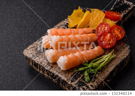 Bowl with shrimps, seafood, rice, oranges, tomatoes with sauce. Bowl with prawns Bowl with shrimps, seafood, rice, oranges, tomatoes with sauce. Bowl with prawns 132348114