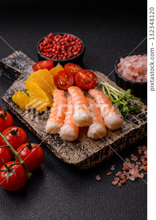 Bowl with shrimps, seafood, rice, oranges, tomatoes with sauce. Bowl with prawns Bowl with shrimps, seafood, rice, oranges, tomatoes with sauce. Bowl with prawns 132348120