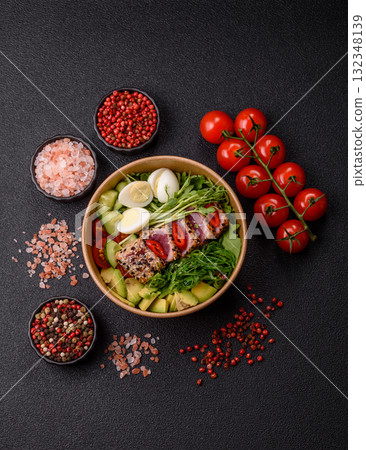 Seafood bowl, tuna tataki fillet slices with rice, oranges, tomatoes and sauce. Tuna bowl 132348139