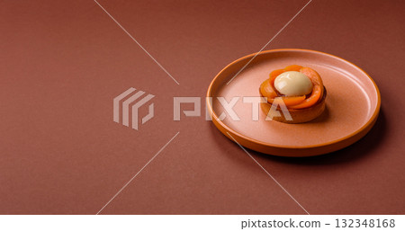 Pie, sweet round tart with apricot pieces, cream and nuts. Sweet tart with peach Pie, sweet round tart with apricot pieces, cream and nuts. Sweet tart with peach 132348168