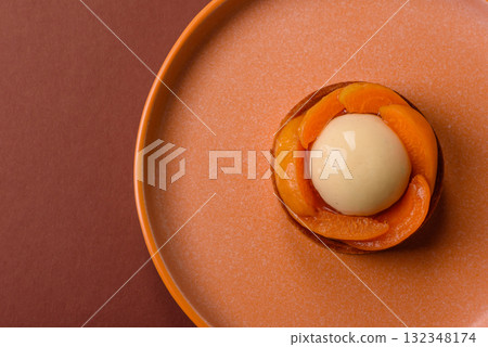 Pie, sweet round tart with apricot pieces, cream and nuts. Sweet tart with peach Pie, sweet round tart with apricot pieces, cream and nuts. Sweet tart with peach 132348174