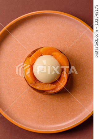 Pie, sweet round tart with apricot pieces, cream and nuts. Sweet tart with peach Pie, sweet round tart with apricot pieces, cream and nuts. Sweet tart with peach 132348175