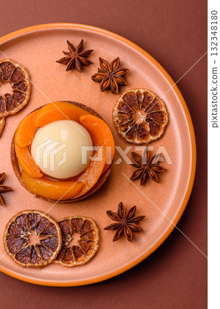 Pie, sweet round tart with apricot pieces, cream and nuts. Sweet tart with peach 132348180