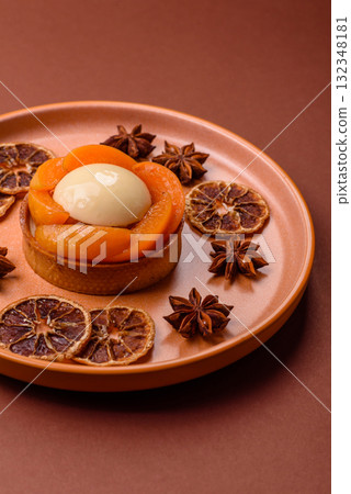 Pie, sweet round tart with apricot pieces, cream and nuts. Sweet tart with peach Pie, sweet round tart with apricot pieces, cream and nuts. Sweet tart with peach 132348181