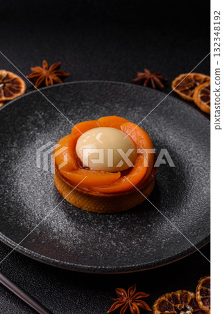 Pie, sweet round tart with apricot pieces, cream and nuts. Sweet tart with peach Pie, sweet round tart with apricot pieces, cream and nuts. Sweet tart with peach 132348192