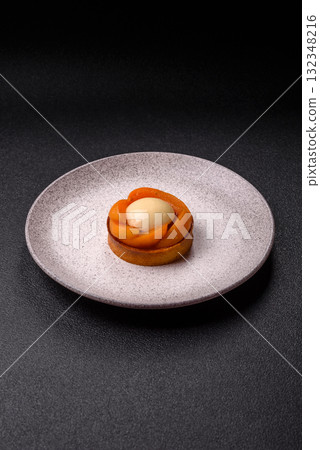 Pie, sweet round tart with apricot pieces, cream and nuts. Sweet tart with peach Pie, sweet round tart with apricot pieces, cream and nuts. Sweet tart with peach 132348216