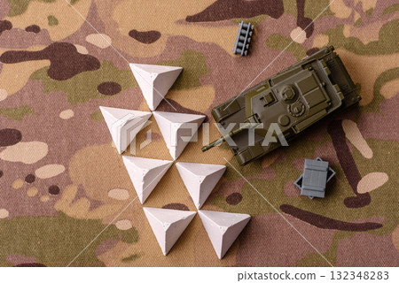 Anti-tank barrier or dragon's teeth made of concrete and iron as a fortification. Dragon's teeth Anti-tank barrier or dragon's teeth made of concrete and iron as a fortification. Dragon's teeth 132348283