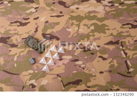 Anti-tank barrier or dragon's teeth made of concrete and iron as a fortification. Dragon's teeth Anti-tank barrier or dragon's teeth made of concrete and iron as a fortification. Dragon's teeth 132348290