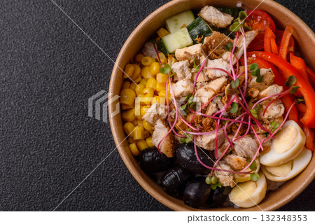 Bowl with chicken pieces, rice, tomatoes, peppers and microgreens. Bowl with chicken 132348353