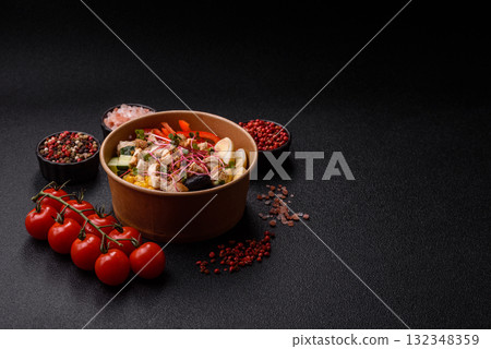 Bowl with chicken pieces, rice, tomatoes, peppers and microgreens. Bowl with chicken 132348359