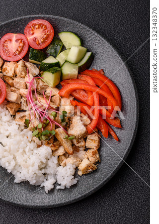 Bowl with chicken pieces, rice, tomatoes, peppers and microgreens. Bowl with chicken Bowl with chicken pieces, rice, tomatoes, peppers and microgreens. Bowl with chicken 132348370