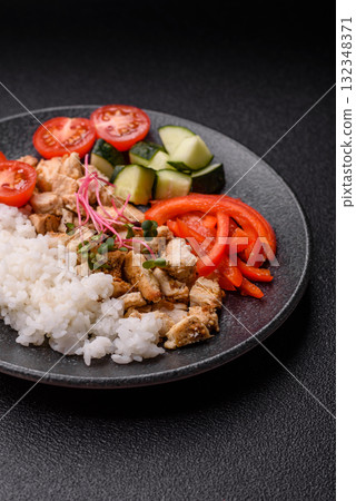 Bowl with chicken pieces, rice, tomatoes, peppers and microgreens. Bowl with chicken Bowl with chicken pieces, rice, tomatoes, peppers and microgreens. Bowl with chicken 132348371