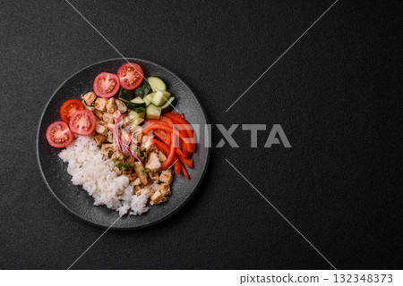 Bowl with chicken pieces, rice, tomatoes, peppers and microgreens. Bowl with chicken Bowl with chicken pieces, rice, tomatoes, peppers and microgreens. Bowl with chicken 132348373
