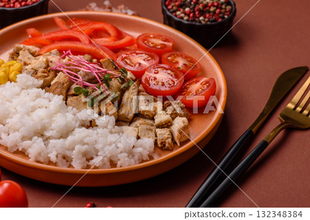 Bowl with chicken pieces, rice, tomatoes, peppers and microgreens. Bowl with chicken Bowl with chicken pieces, rice, tomatoes, peppers and microgreens. Bowl with chicken 132348384