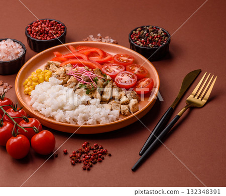 Bowl with chicken pieces, rice, tomatoes, peppers and microgreens. Bowl with chicken Bowl with chicken pieces, rice, tomatoes, peppers and microgreens. Bowl with chicken 132348391