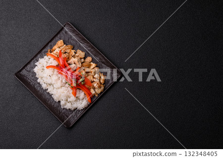 Bowl with chicken pieces, rice, tomatoes, peppers and microgreens. Bowl with chicken 132348405