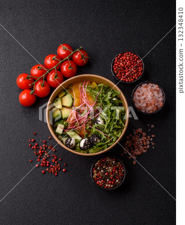 Bowl with salmon pieces, cheese, tomatoes, peppers and avocado. Salmon bowl Bowl with salmon pieces, cheese, tomatoes, peppers and avocado. Salmon bowl 132348410