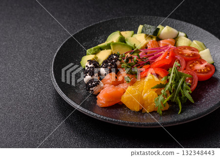 Bowl with salmon pieces, cheese, tomatoes, peppers and avocado. Salmon bowl 132348443