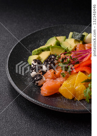 Bowl with salmon pieces, cheese, tomatoes, peppers and avocado. Salmon bowl 132348446