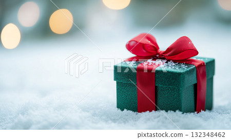 gift box on snow in winter with blur background gift box on snow in winter with blur background 132348462