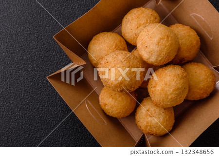 Cheese balls, croquettes or arancini with potatoes or rice. Cheese balls Cheese balls, croquettes or arancini with potatoes or rice. Cheese balls 132348656