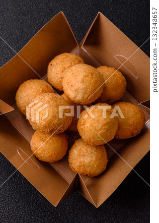 Cheese balls, croquettes or arancini with potatoes or rice. Cheese balls Cheese balls, croquettes or arancini with potatoes or rice. Cheese balls 132348657