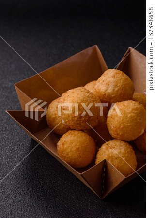 Cheese balls, croquettes or arancini with potatoes or rice. Cheese balls Cheese balls, croquettes or arancini with potatoes or rice. Cheese balls 132348658