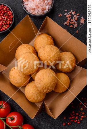 Cheese balls, croquettes or arancini with potatoes or rice. Cheese balls Cheese balls, croquettes or arancini with potatoes or rice. Cheese balls 132348661